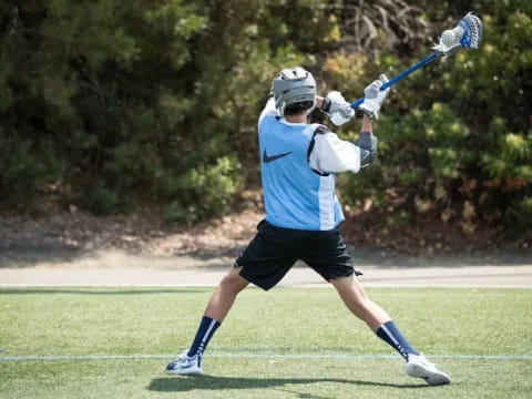 a person swinging a baseball bat