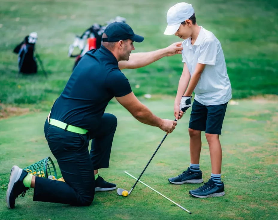 a person swinging a golf club