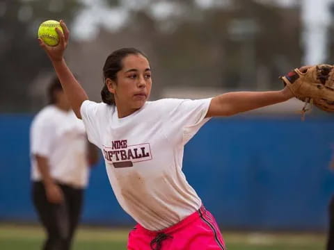 a person throwing a baseball