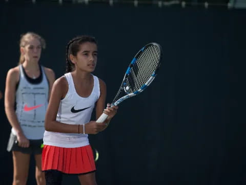 a couple of women playing tennis