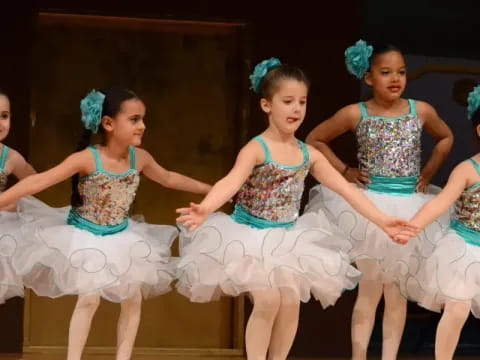 a group of girls in dresses