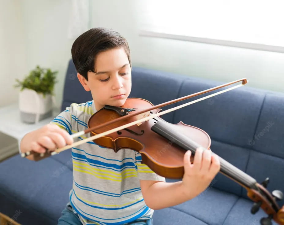 a boy playing a violin