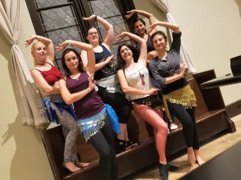 a group of women posing for a photo