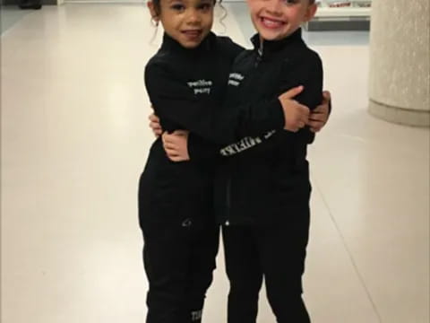 a couple of children hugging