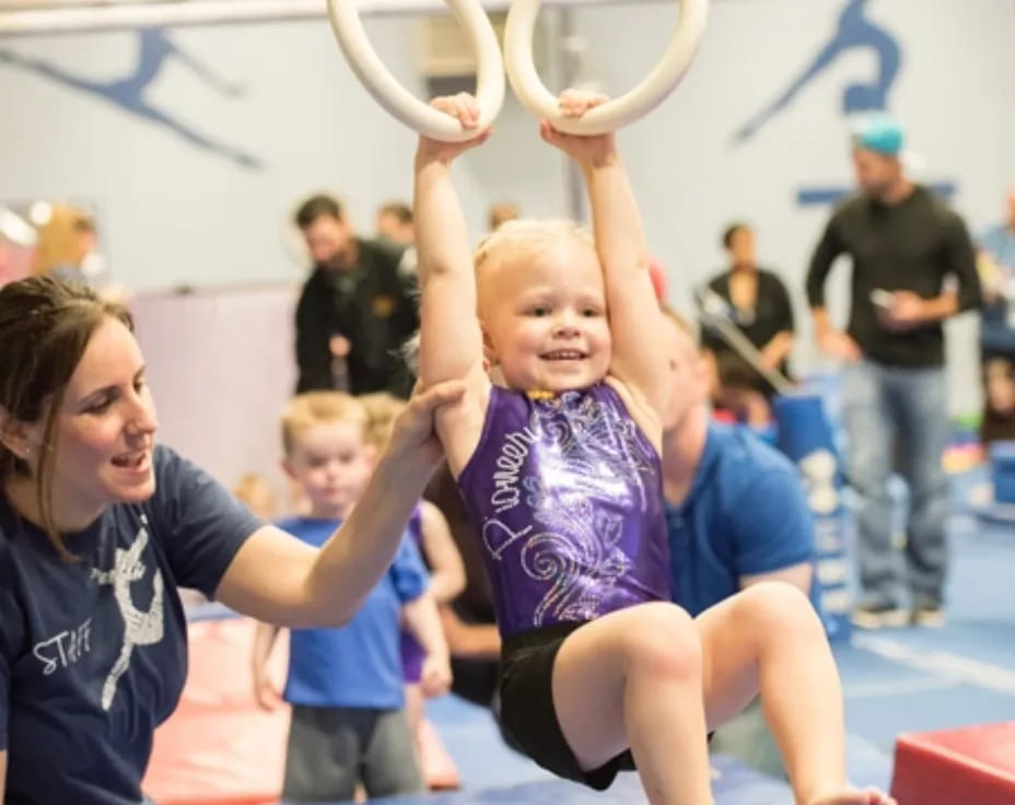 a group of people lifting weights