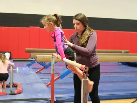 a woman holding a barbell