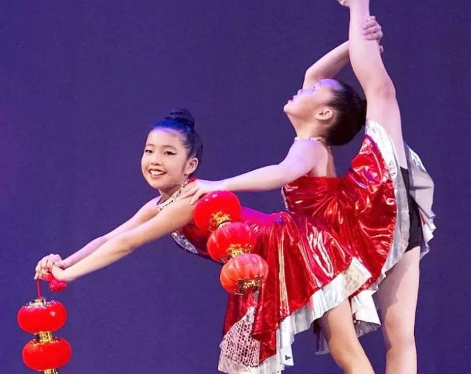 a couple of girls dancing