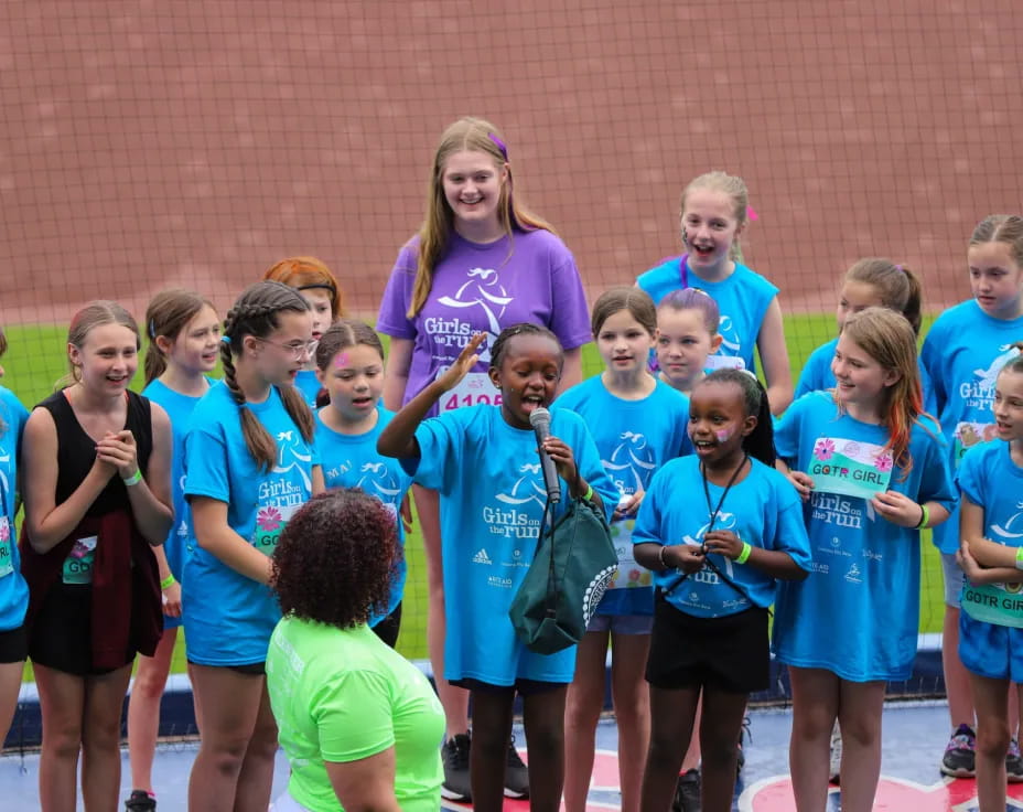 a group of people in matching blue shirts