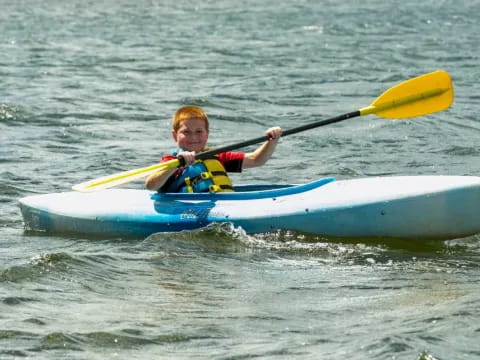 a boy in a kayak