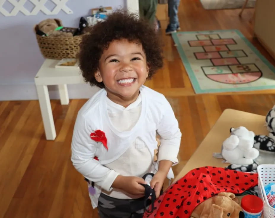 a child smiling at the camera