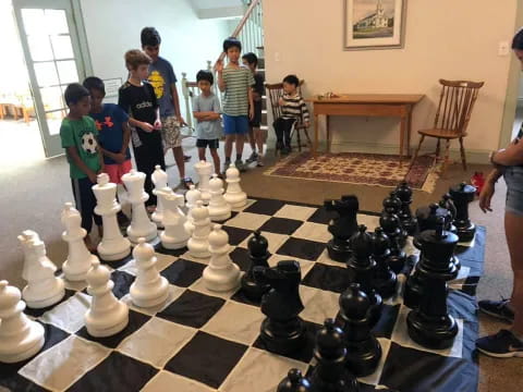 a group of people playing chess