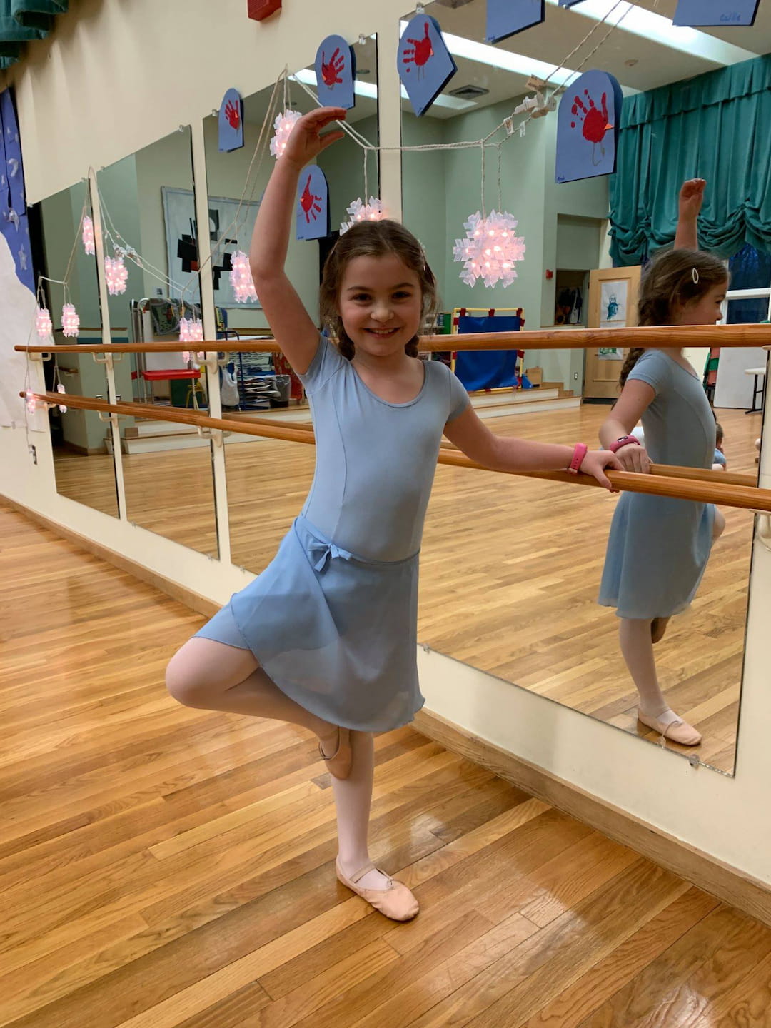 a girl holding a toy