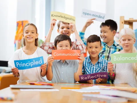 a group of children holding signs