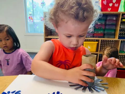 a young boy cutting a cake