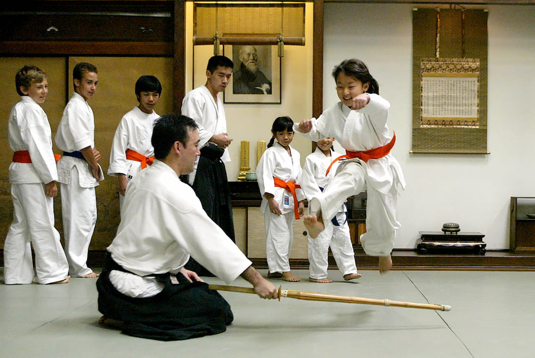 a group of people in karate uniforms