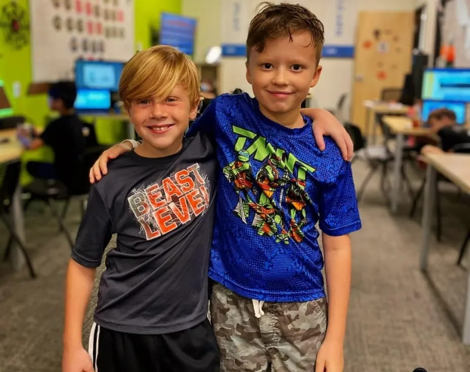two boys posing for a picture