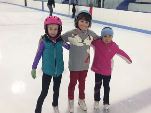 a group of girls on an ice rink