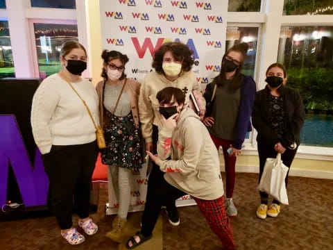 a group of people wearing masks