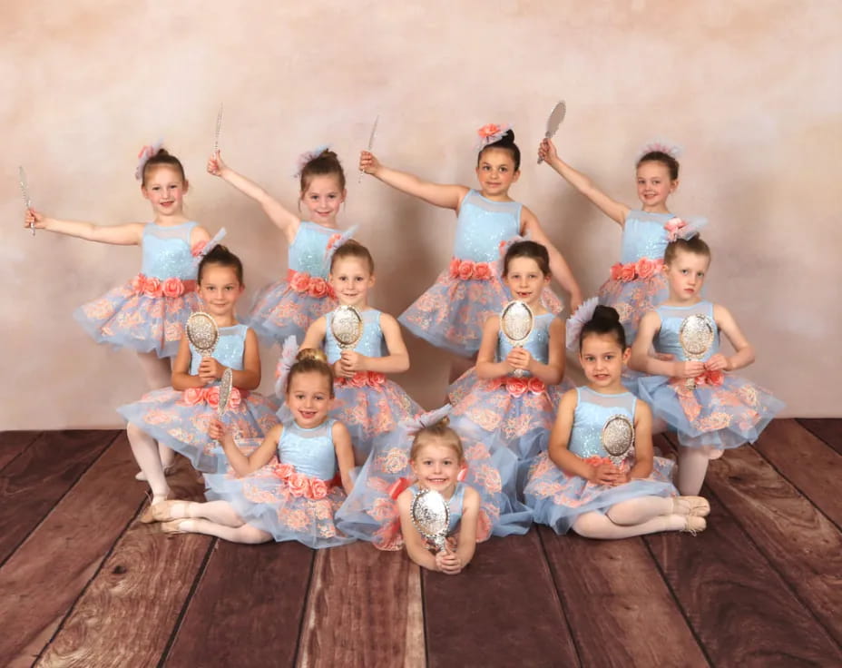a group of children in dresses
