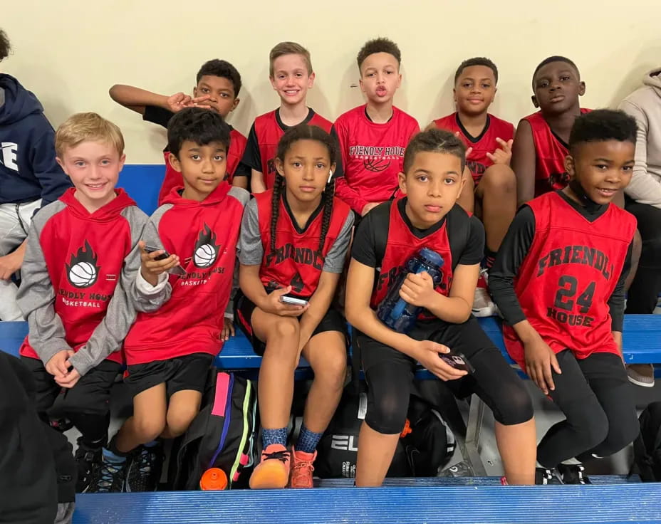a group of boys in red shirts