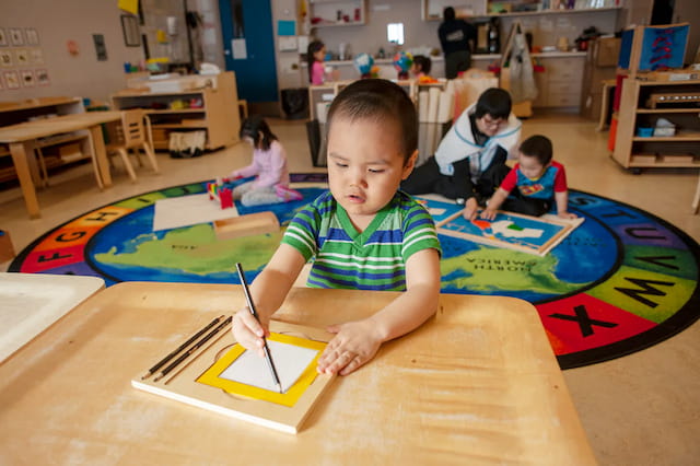 a group of children painting