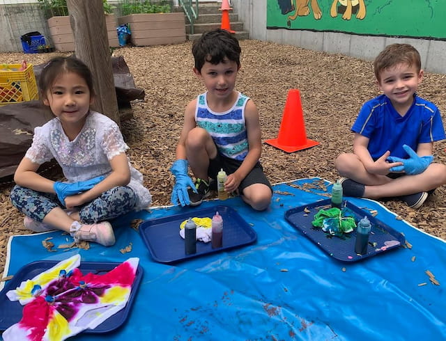 a group of children playing with toys