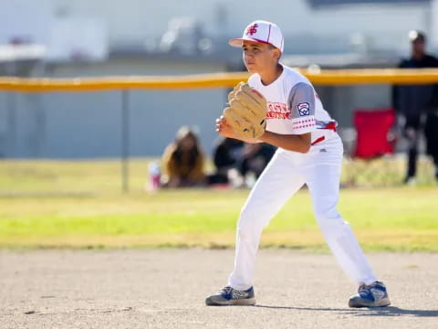 a young boy playing baseball