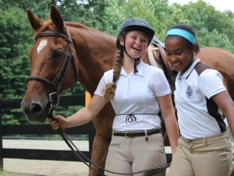 a couple of women with a horse