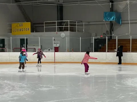 a group of people on an ice rink