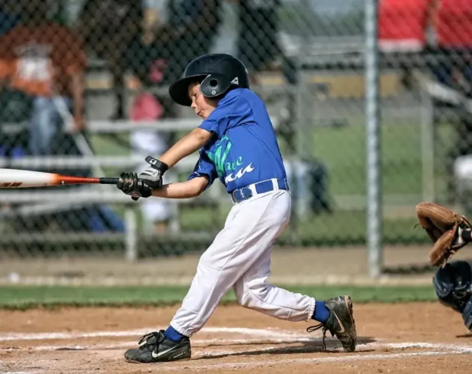 a baseball player swinging a bat
