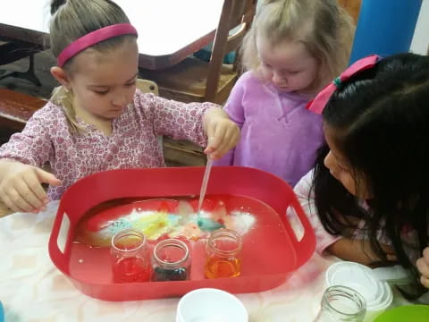 a group of children painting