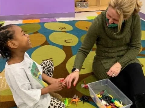a woman and a girl painting