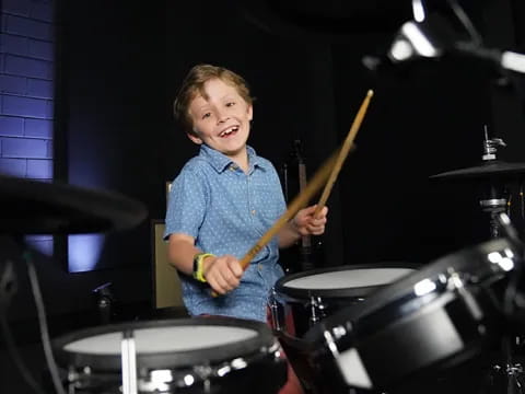 a boy playing drums