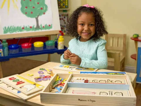 a girl sitting at a table