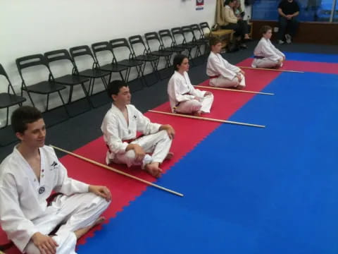 a group of people in karate uniforms