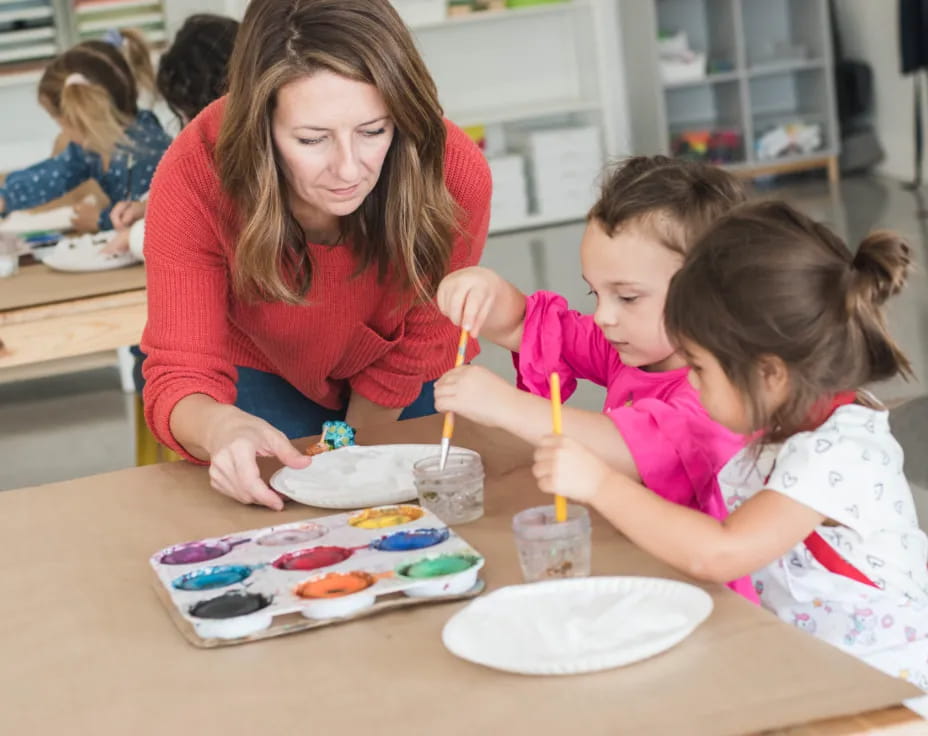 a person and a child painting