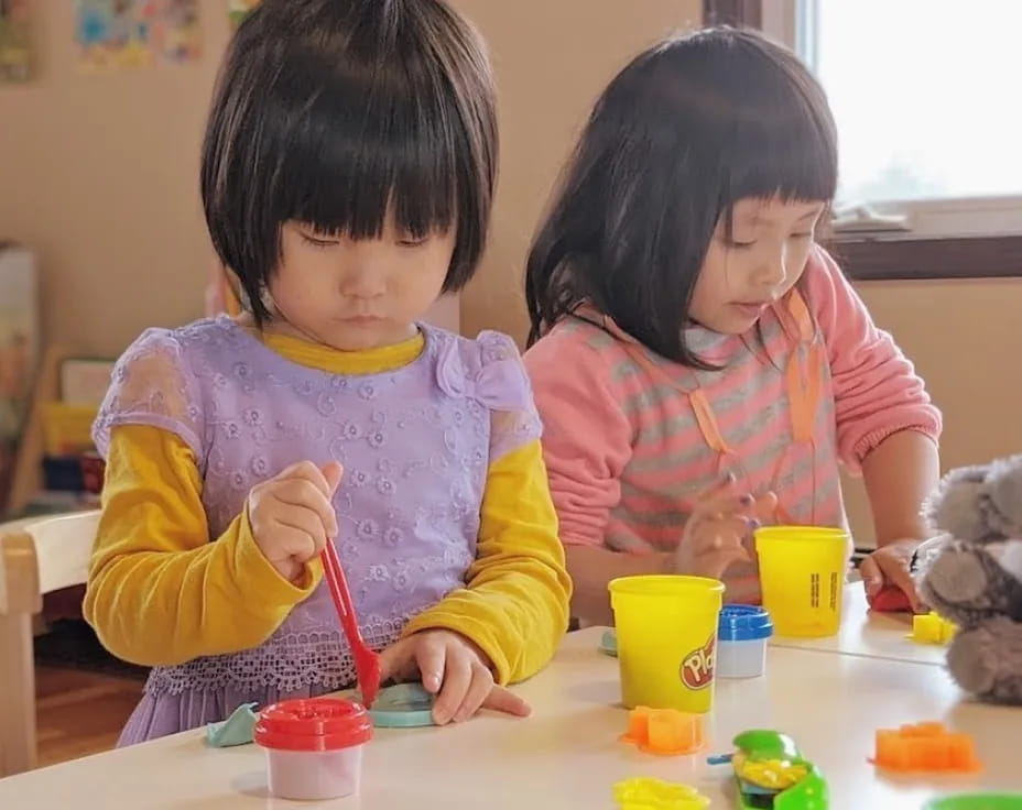 a couple of young girls painting