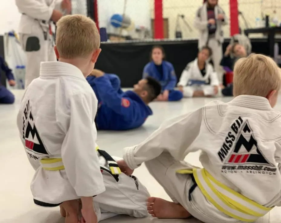a group of boys in white shirts