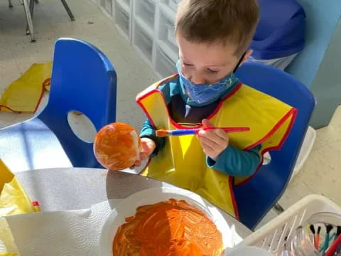 a child sitting at a table