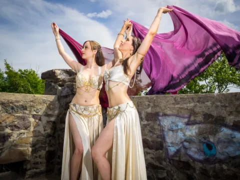 a couple of women in dresses