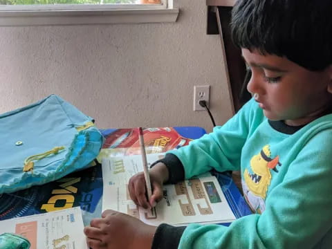 a young boy using a computer