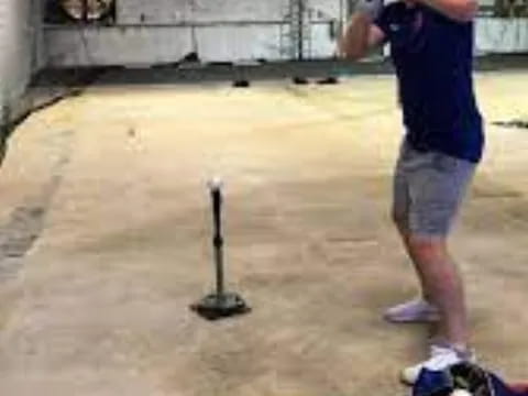 a man holding a baseball bat