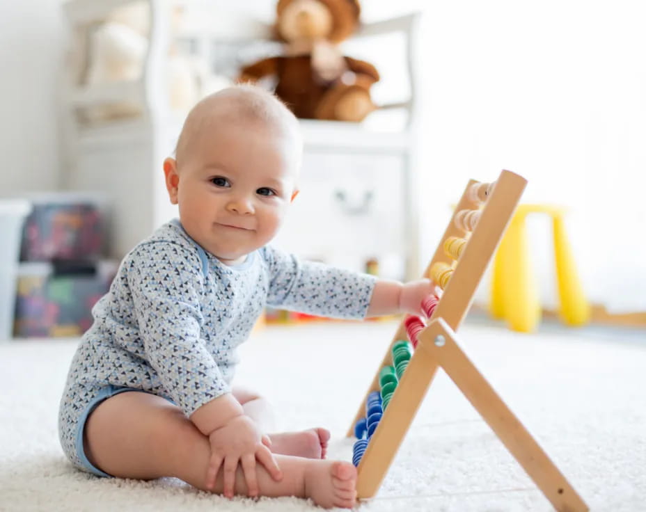 a baby sitting on the floor