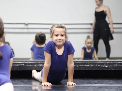 a girl sitting on a bench