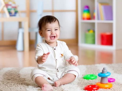 a baby sitting on the floor
