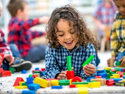 a young girl playing with toys
