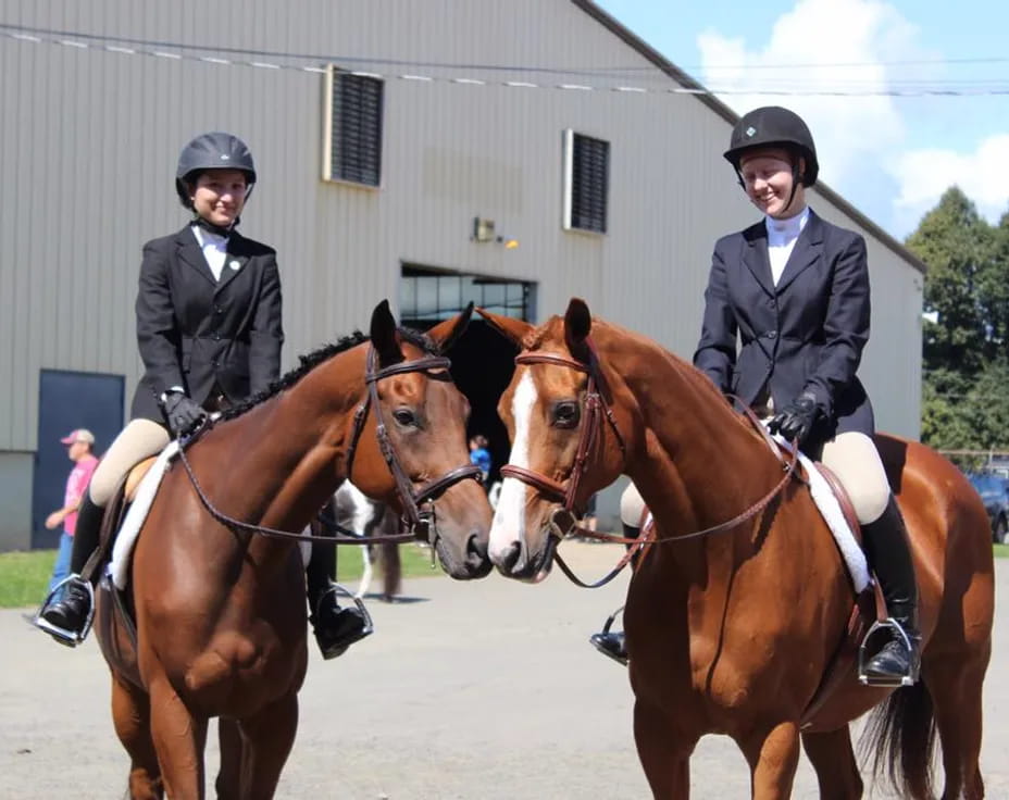 a group of people ride on horses