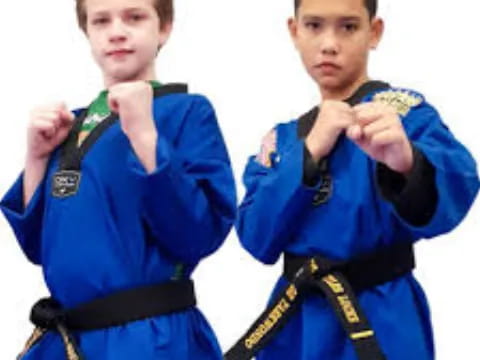 a couple of boys in blue uniforms