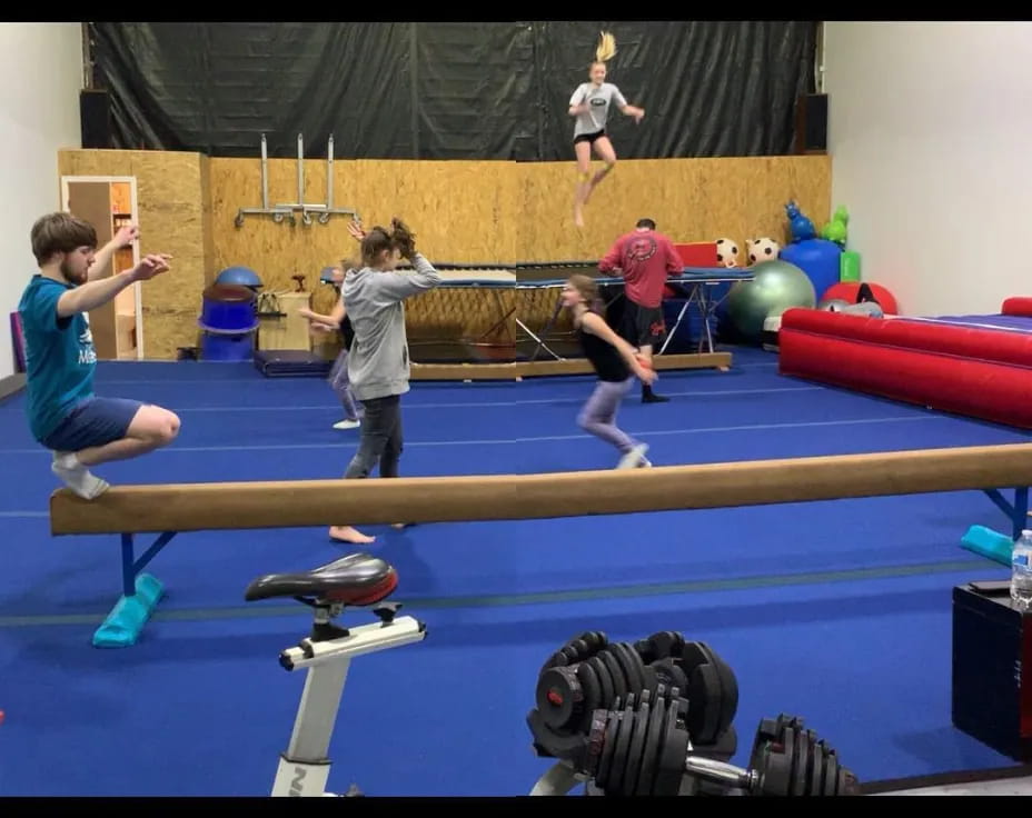 a group of people in a gym