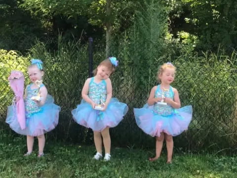 a group of girls in dresses